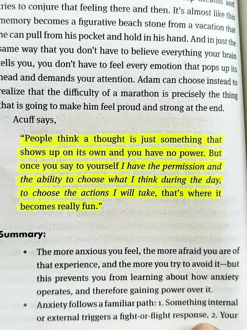 Close-up photo of a printed book page about managing thoughts, emotions, anxiety and choosing actions