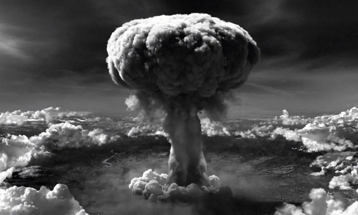 Black-and-white mushroom cloud explosion evoking the destructive stakes of totalitarianism and freedom in The Red New Deal book