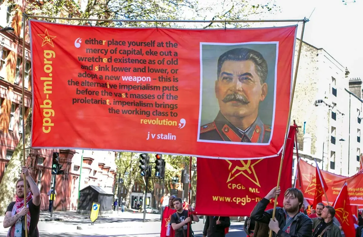 Abstract photo with partially readable text related to revolution and Stalin, used as artwork for a Soviet memoir Kindle page
