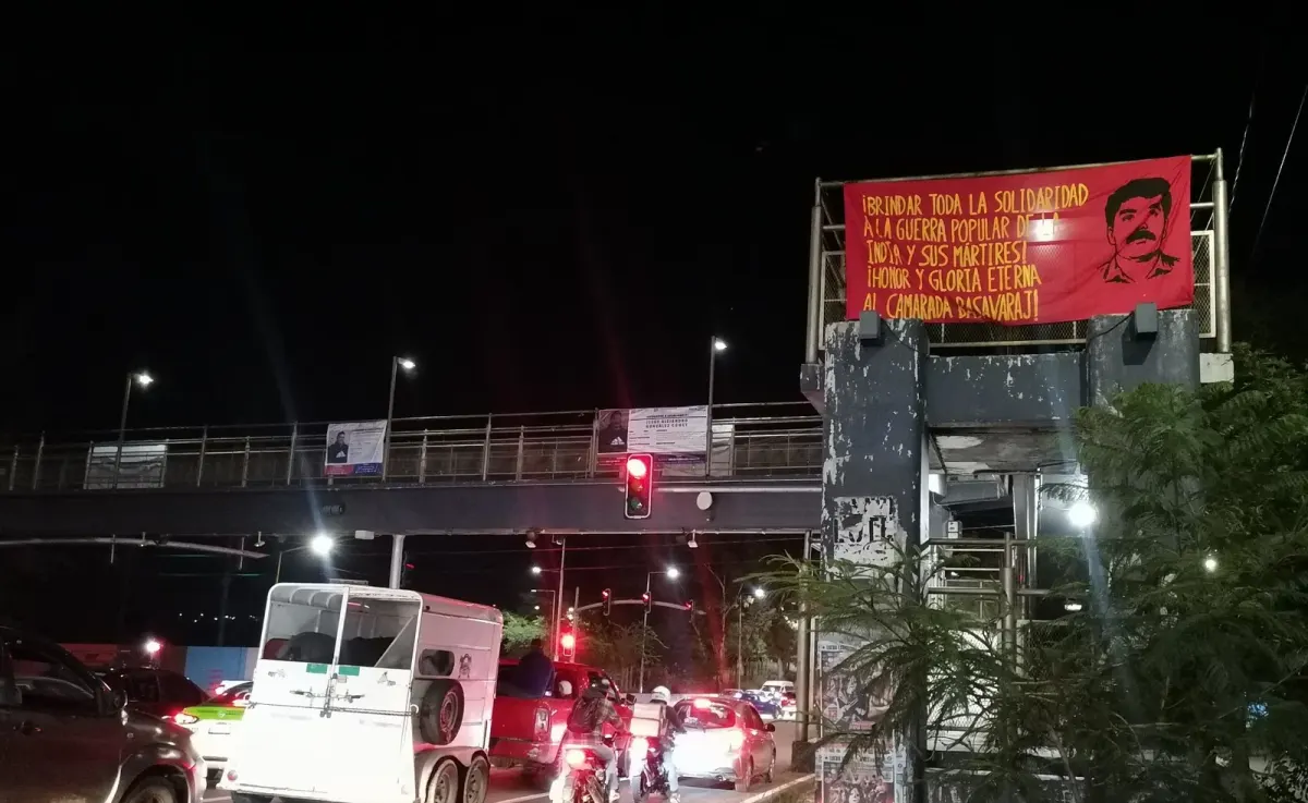 Landscape photo with partially readable Spanish protest or solidarity text